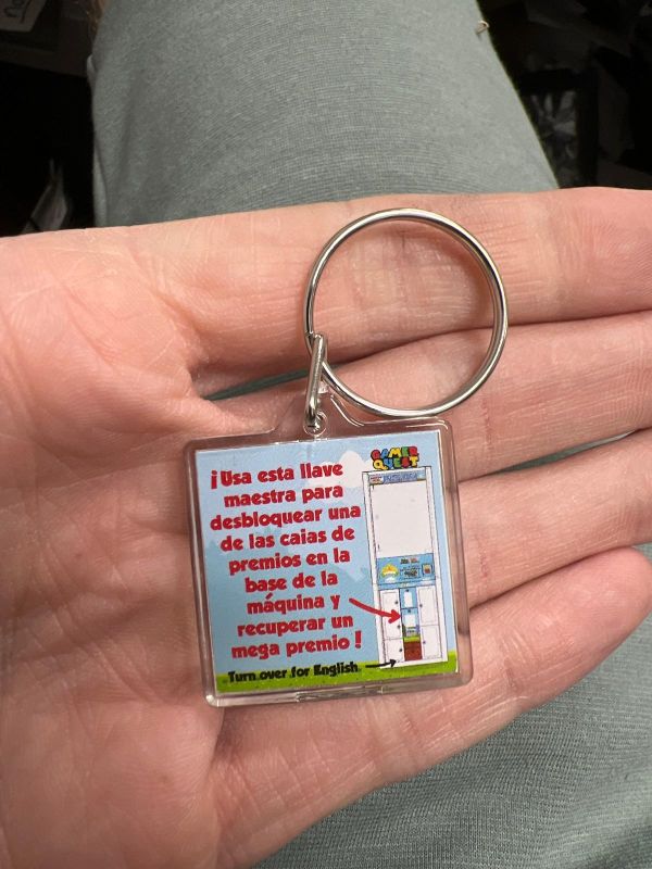 Instruction keychain for Claw Machine with prize box below