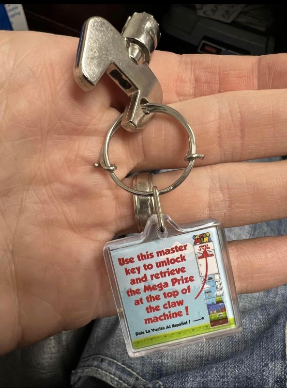 Instruction keychain for Claw Machine with prize box up top